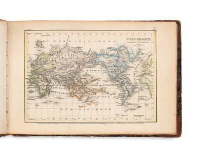 an old book with a map of the world on it