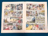 an old comic book opened to show a page of comics