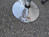a silver umbrella that is sitting on the ground