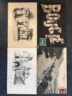 four postcards of different types of artwork on a blue surface