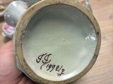 a person holding a cup that has a name on it