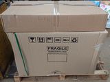 a cardboard box sitting on a pallet in a warehouse