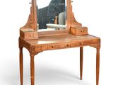 une petite coiffeuse en bois surmontée d'un miroir