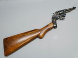 a gun that is sitting on top of a table