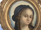 portrait of a young girl in a blue bonnet and a black beret