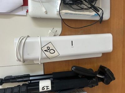 a camera and a tripod sitting on a table
