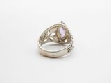 a close up of a ring on a white surface