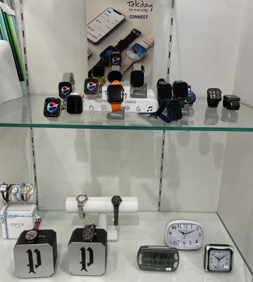 many different types of electronic devices on display in a glass case
