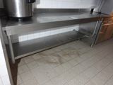 a stainless steel counter with a pot on top of it