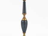 an image of a black and gold lamp on a white background