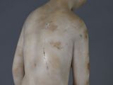 a statue of a man with a bare torso