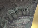 bronze sculpture of a rock with a river running through it