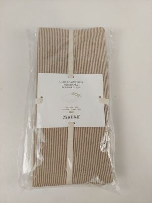 brown and white striped napkins wrapped in plastic on a white table