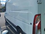 a white van that is parked in a parking lot