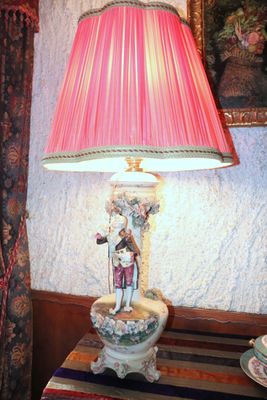 a lamp that is sitting on a table in a room