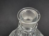 a clear glass vase with a clear top on a black background