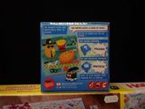 a box of toys on a table with a black background