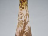a glass vase with a floral design on it