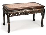 an old table with a marble top on a white background