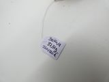 a tea bag with a tag on it sitting on a white plate