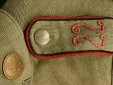 a close up of a military uniform with a medal on it