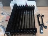 a black radiator sitting on top of a wooden table
