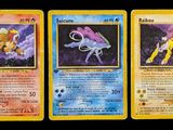 three pokemon cards are shown on a black background