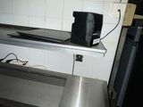 an image of a kitchen with a sink and a coffee maker