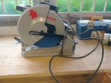 someone is using a circular saw to cut a piece of wood
