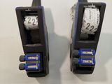 two black and blue machines on display on a wall