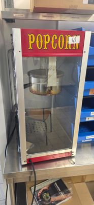 a popcorn machine that is sitting on a table