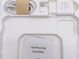 a white box with a charger and a cable attached to it