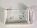 a plastic container with two small white buttons on it