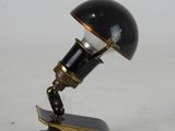 a black lamp that is on top of a table