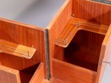 a close up view of a wooden cabinet with drawers