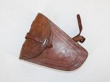 brown leather holster with a leather strap on a white background