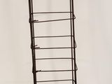 an image of a metal display rack with five shelves
