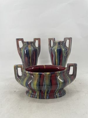 three vases that are sitting on a table
