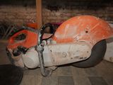 a motorcycle that is sitting on the floor in the room