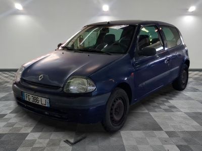 a picture of a small blue car parked in a garage