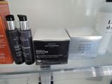 many different types of skin care products displayed on a shelf