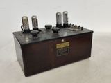 a close up of a wooden box with three vacuums on it