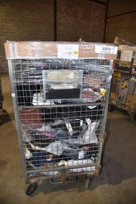 a metal cart with many items in it in a warehouse