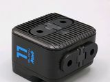 a small black device with a blue logo on it