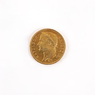 une pièce d'or sur laquelle figure l'image d'un homme