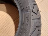 a tire that is sitting on a cardboard box