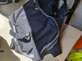 a backpack and a pair of shoes sitting on the floor