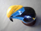 a figurine of a bird with a blue and yellow beak