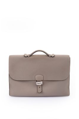 a grey leather briefcase with a metal clasp on the handle