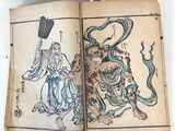 an open book with a drawing of a man on a horse